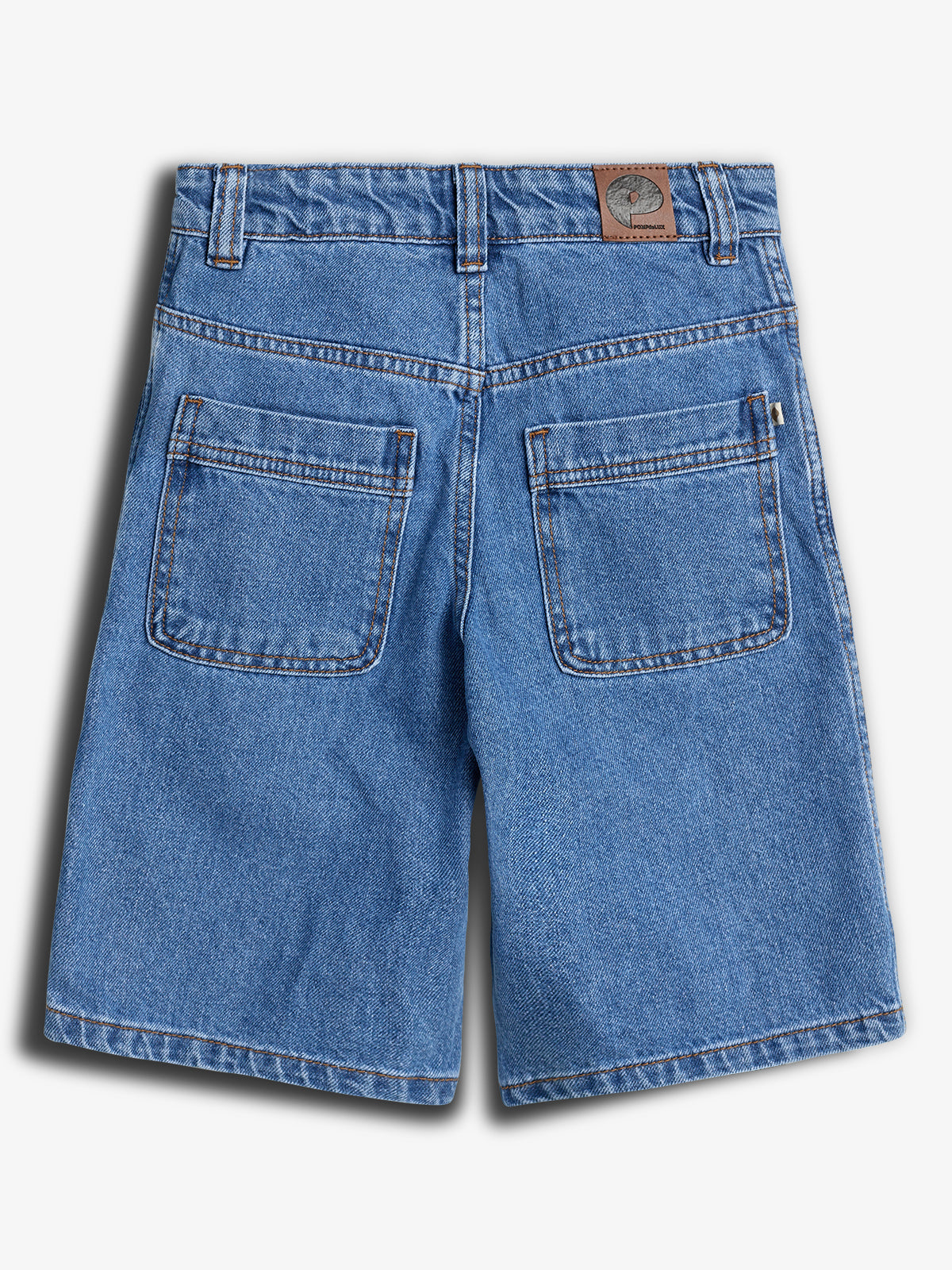 Denim shorts, displayed flat, feature two back pockets, belt loops, and a leather patch with a tree logo and “TreeHouse” text on the upper right. Set against a light background.