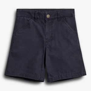 Dark blue shorts lie flat against a plain white background, featuring front pockets, belt loops, and a metallic button closure.