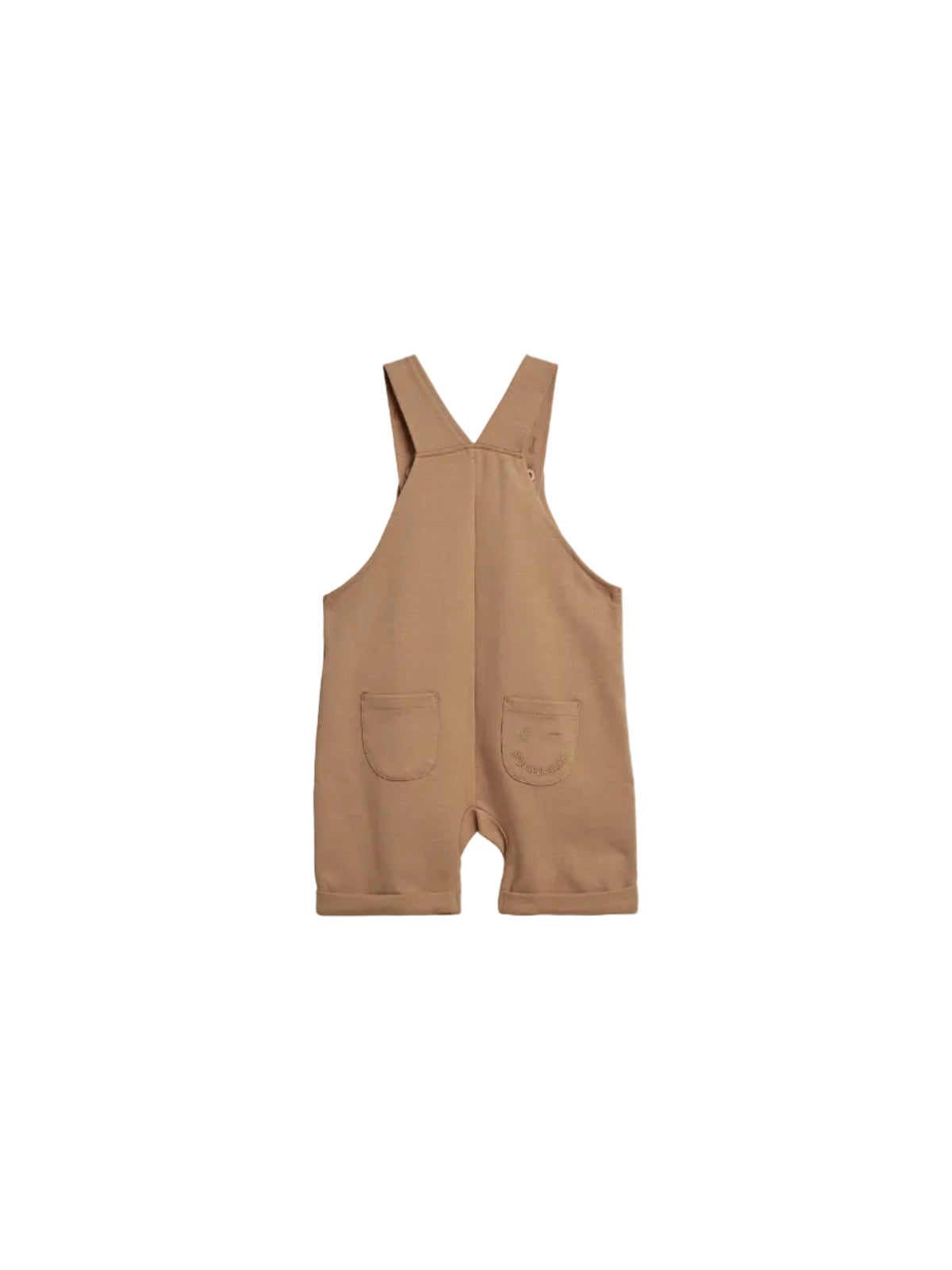 A tan-colored toddler romper with two front pockets, featuring an embroidered face and the text "POMPdeLUX" on the right pocket. It has wide straps and is displayed on a plain background.