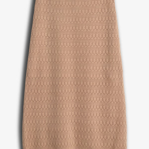 A beige, knee-length skirt with a zigzag knit pattern is placed against a plain white background, highlighting its textured design and scalloped hem.