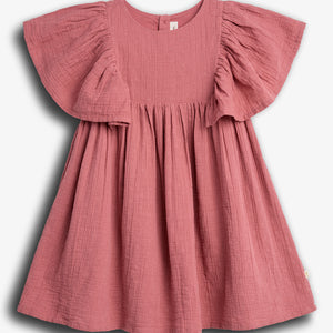 A pink, short-sleeved, textured dress hangs against a plain white background. The dress features ruffled sleeves and a gathered waist, creating a flowy silhouette.