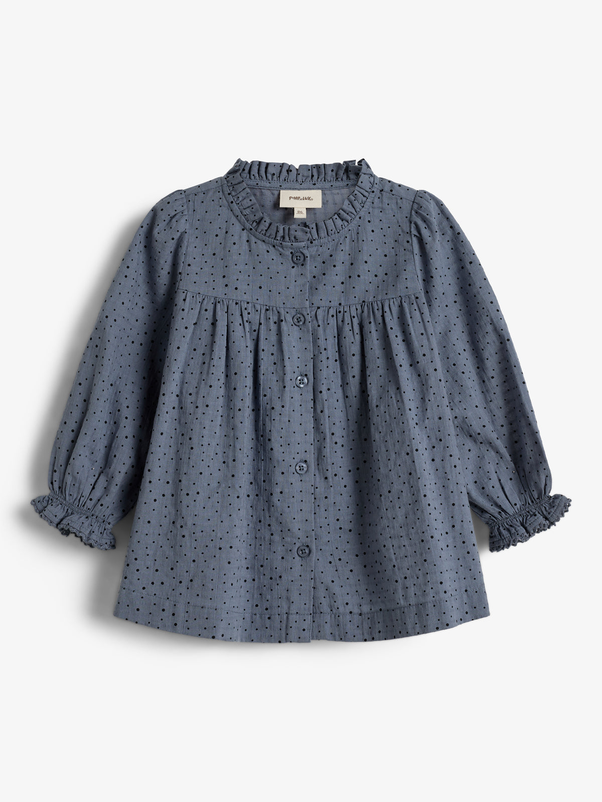 Blue polka dot blouse with buttons and ruffled collar and cuffs, on a plain white background. A small tag reads "pimelove 36M" inside the collar.