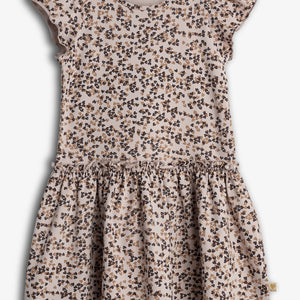 A short-sleeved girl's dress with a ruffled skirt features a pattern of small brown and black bows. It hangs against a plain white background.