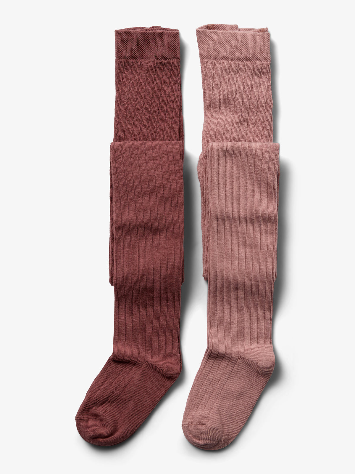 Two pairs of ribbed knit tights lie flat side by side. One is dark red, the other is dusty pink, both against a plain white background.
