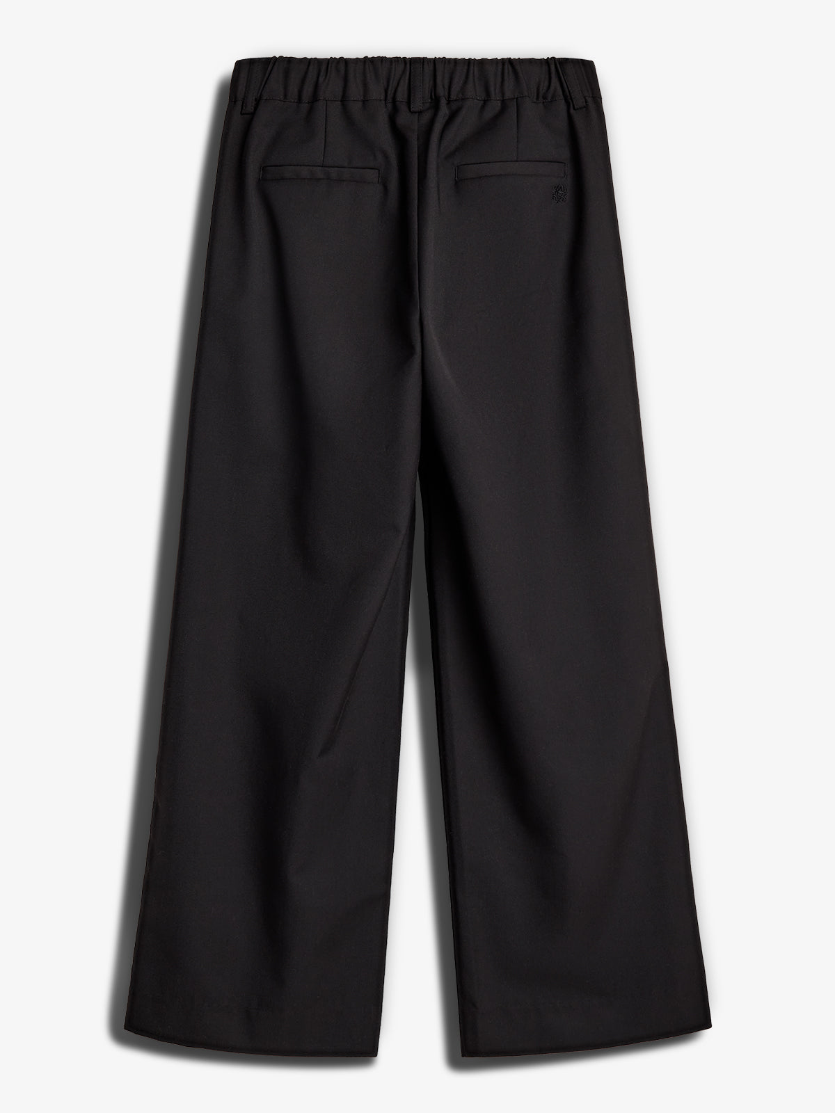 Black pants lie flat on a white background, featuring an elastic waistband and two back pockets. The fabric appears smooth and the pants have a wide-leg design.